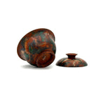 showcasing the gaiwan's exterior urushi layers with marbled design on a white background